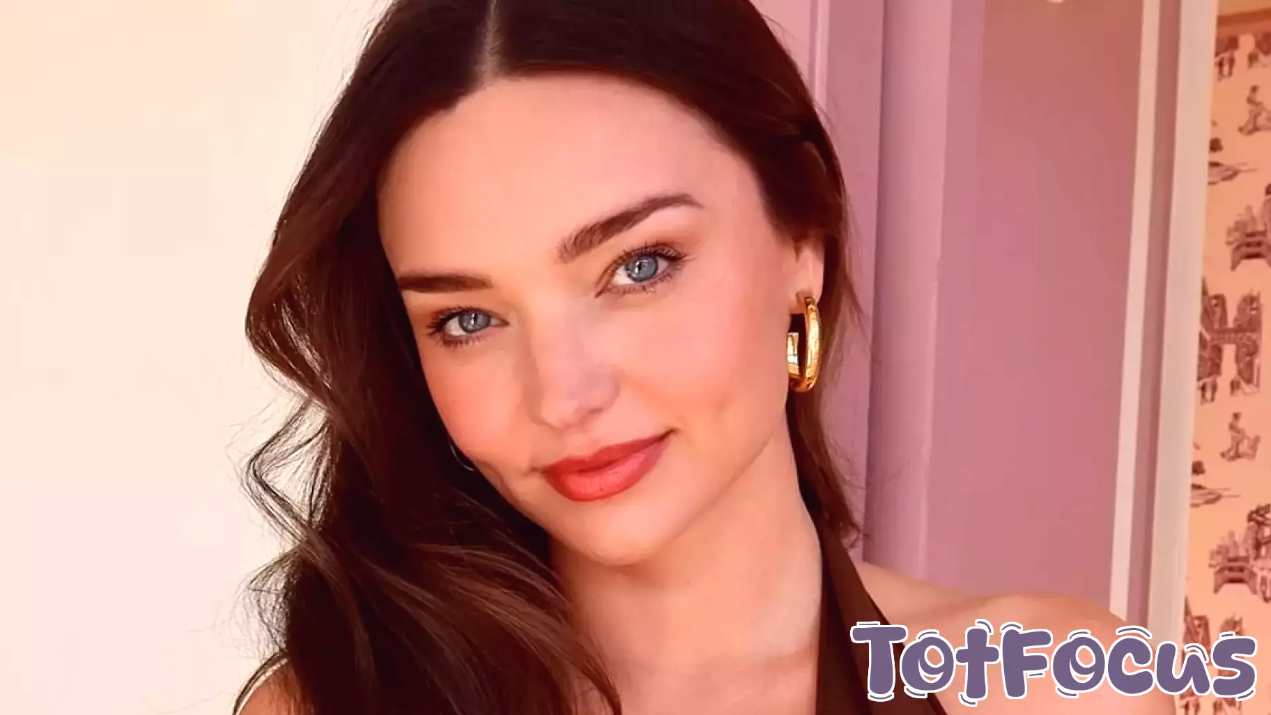 Miranda Kerr looks incredible in a plunging brown dress in New York